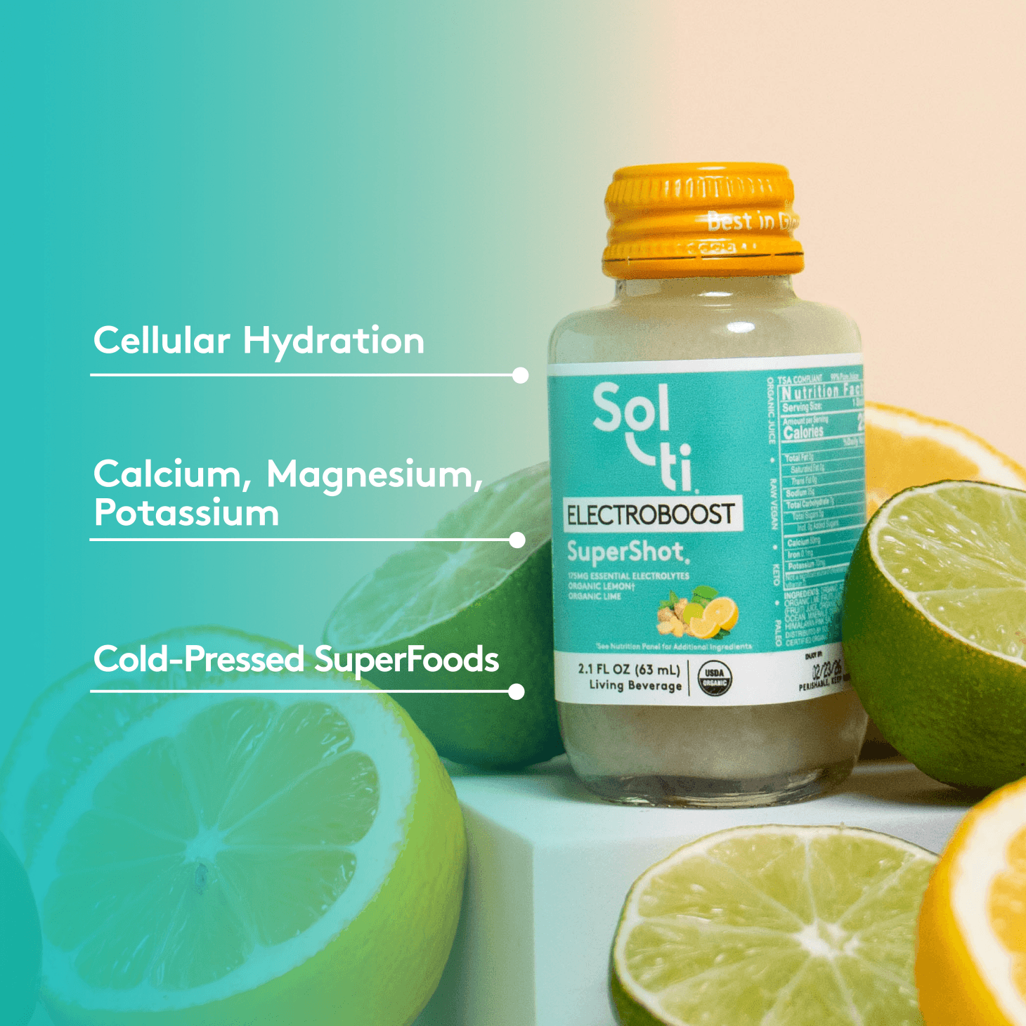 Sol-ti ELECTROBOOST SuperShot glass bottle with front label on light turquoise background, with lime and , lemon slice s, benefits text including restore electrolytes, cellular hydration and natural energy