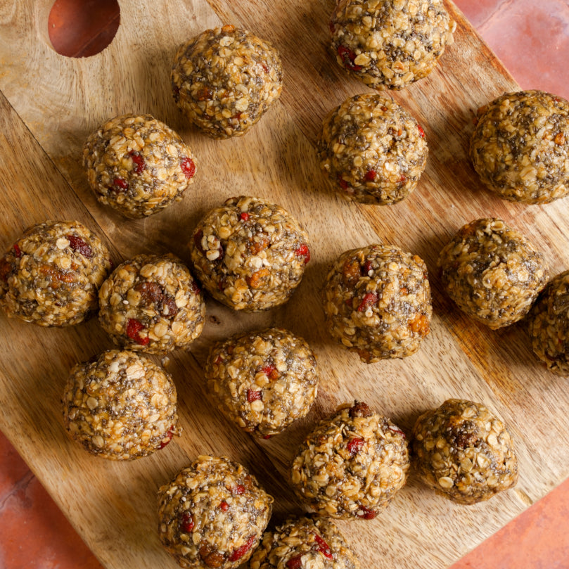 Nuts and seeds balls on a wooden board
