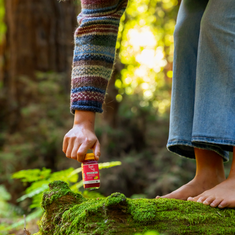 Sol-ti GINGER BEET SuperShot bottle held downward, front label, green background