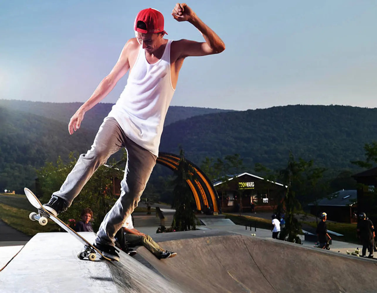 Joey Brezinski skateboarding on an outdoor concrete ramp at a skatepark
