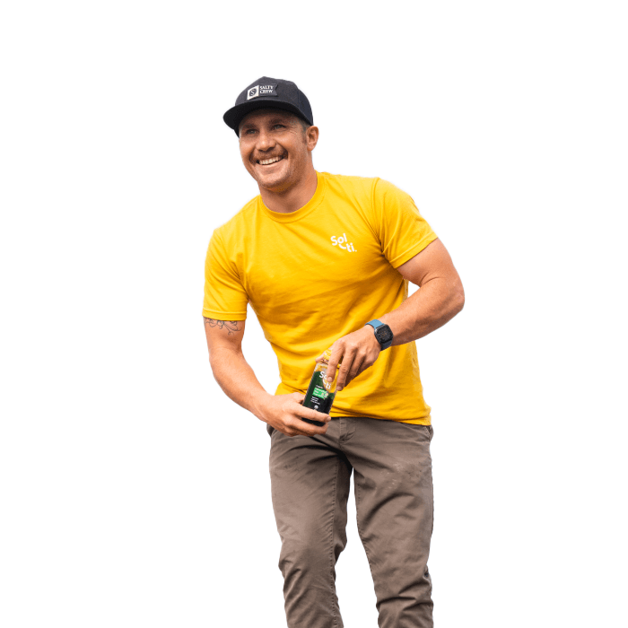a man in a yellow shirt white Sol-ti white logo and black hat holding a SuperAde