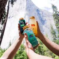 Thumbnail for hands holding SuperAde bottles with a mountain behind