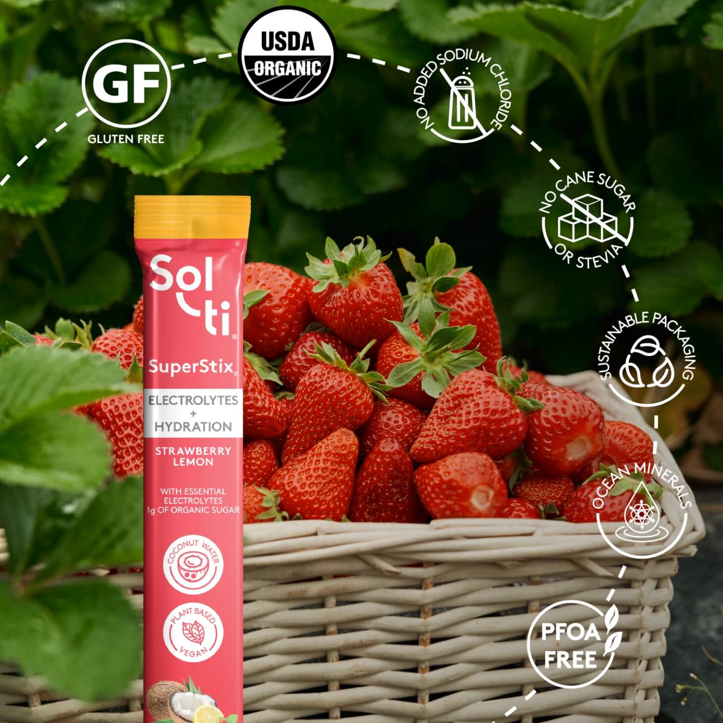 A Sol-ti Strawberry Lemon SuperStix, next to strawberries