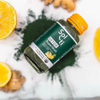 Thumbnail for a bottle of DETOX SuperShot with green spirulina, ginger root and lemon slices