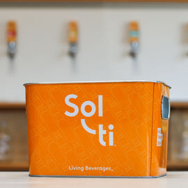 Orange Aluminum Ice Bucket with white Sol-ti logo shown against a light background